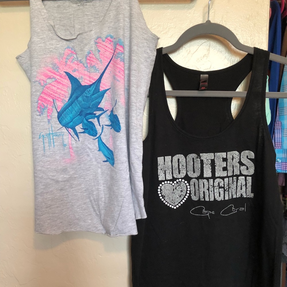 Gray guy Harvey shirt and black hooters shirt